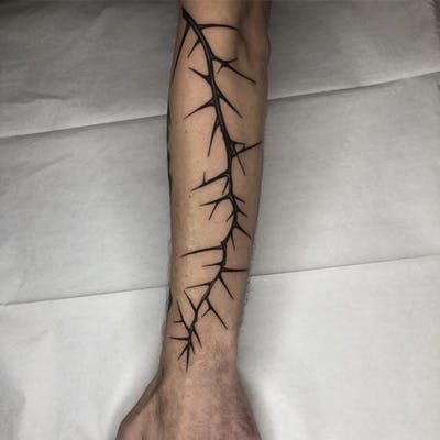 Tattoo by Tine DeFiore #TineDeFiore #thorntattoos #thorntattoo #thorns #thorn #nature #plant #illustrative Thorns Spine Tattoo, Rose Thorn Tattoo, Thorns Tattoo, Thorn Tattoo, Barbed Wire Tattoos, Ancient Tattoo, Vine Tattoos, Tattoo Style Drawings, Book Tattoo