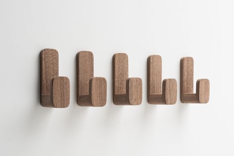 These self-adhesive wall hooks made of solid walnut wood are a great addition to any  bedroom, entryway or kitchen. The hooks have a self-adhesive strip that can hold small accessories up to 2 kg (4.4 lbs).  The walnut wood has a nice dark color.   Measurements:  Height: 70 mm Width:  21 mm Depth: 38 mm This is a set of 5 pieces. -For use in bathrooms it is recommended to finish the hooks with 2 layers of transparant lacquer and sand in between the 2 layers.  -The surface to which they are attac Wood Towel Hooks, Wall Hangers For Clothes, Danish Oil Finish, Wooden Coat Hooks, Wooden Wall Hooks, Adhesive Wall Hooks, Hat Hooks, Wooden Accessories, Wall Decor Design