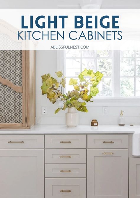 Light beige kitchen cabinets are such a game-changer! They bring a soft, airy feel to your kitchen while keeping it neutral and timeless. Plus, they go with pretty much any style, whether you're into modern or farmhouse vibes. We’ve got tons of light beige cabinet ideas to inspire you! #kitchengoals #lightbeigekitchencabinets #kitchencabinets Beige And Brass Kitchen, Creamy Taupe Kitchen Cabinets, Sand Color Kitchen Cabinets, Soft White Cabinets Kitchen, Small Beige Kitchen, Kitchen Cabinet Beige, Light Beige Kitchen Cabinets, Sand Kitchen Cabinets, Natural Cream Cabinets