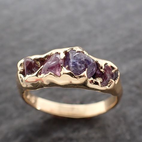 Lovely purple lavender and violet sapphires (home tumbled). I hand carved this setting in wax and cast it in recycled solid 18k yellow gold using the lost wax casting process. This one-of-a-kind gemstone ring is a size 7 it can be resized up or down for you as needed. The sapphire stones measure about 3-5mm. the band is around 2.5mm Throughout all time and history in every tribe and culture all around the world crystals, minerals and gemstones have been used for healing, luck, divination, adornm Hippie Engagement Rings, Custom Gold Rings, Sapphire Stones, Raw Gemstone Jewelry, Raw Gemstone Ring, Earthy Jewelry, Cute Engagement Rings, Purple Jewelry, Magical Jewelry