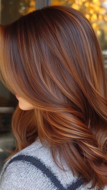 Embrace the beauty of fall with 32 stunning hair color ideas. From rich mocha to soft rose gold, these shades capture the essence of autumn. Explore a palette of earthy tones and vibrant hues inspired by the changing landscape. Find the perfect color to transform your locks and stay on-trend throughout the cooler months. Hair Color Ideas For Brunettes Copper, Auburn Dimensional Hair, Copper Hair Straight, Cowboy Cooper On Dark Hair, Autumn Palette Hair Color, What Goes With Orange, Sizzling Copper Hair, Brunette With Auburn, Copper Red Hair With Highlights