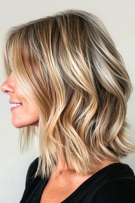 33 Chic Medium-Length Hairstyles for Women Over 50 - The Hairstyle Edit Sophisticated Medium Length Hairstyles, Short Beachy Waves Hair, Medium Length Hair With Waves, Blonde Highlights Over 50, Mid Length Fine Hair Styles For Women, Mid Length Hair With Highlights, Hair For Over 50 Women, Short Medium Blonde Hair, Medium Length Blonde Hair With Layers