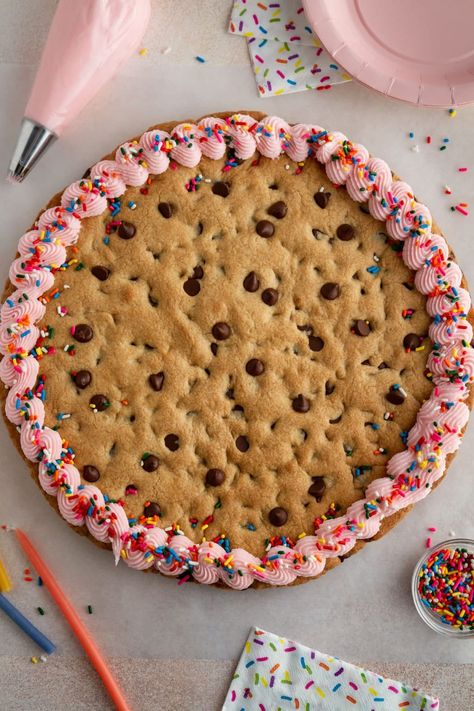 Get ready to celebrate any occasion with this soft and chewy chocolate chip cookie cake! Decorate it with a classic vanilla buttercream frosting or add your own favorite toppings to make it fun for your special day. Perfect for birthdays! Yummy Bars, Giant Chocolate Chip Cookie, 2024 Recipes, Chocolate Chip Cookie Cake, Vanilla Buttercream Frosting, Cookie Cake Recipe, Cookie Butter, Recipe Girl, Delectable Desserts