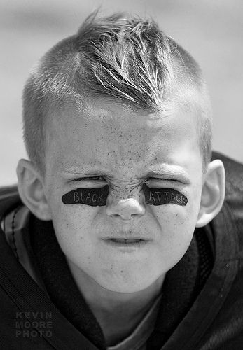 Sam: This little boy is a perfect example of imagery because those black lines on his face is exactly what our products are, and if you look closely there is white writing on them and that is what comes with our product.  This is show what it will look like on our persona and how clean and neat it is on the face which will really attract our persona. Football Dance, Football Photoshoot, Peewee Football, Sports Portraits, Cheer Photography, Football Poses, Football Pics, Boys Football, Sport Portraits