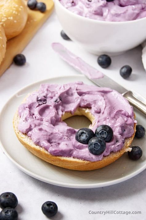 This homemade blueberry cream cheese is creamy, rich, and full of delicious berry flavor. With just 5 ingredients and ready to eat in 20 minutes, the recipe is super simple to make and the perfect breakfast spread for bagels, toast, and muffins. Can also be used as a fruit dip or frosting or icing for cupcakes, cookies, coffee cake, or filling for puff pastry and French toast. Or enjoy it with waffles, pancakes, and French toast, or eat it by the spoonful. | CountryHillCottage.com Filling For Puff Pastry, Icing For Cupcakes, Spread For Bagels, Bagel Fillings, Recipes With Cool Whip, Blueberry Bagel, Bagel Toppings, Breakfast Spread, Cheese Alternatives