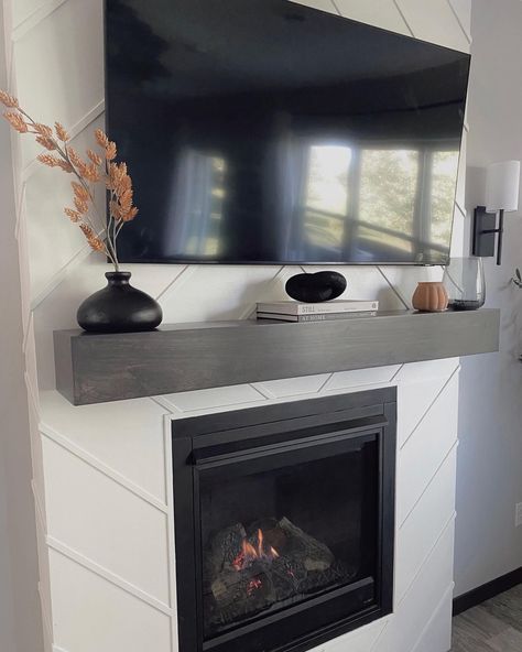 Fireplace Decor With Tv Modern, Low Profile Mantle Decor Under Tv, Dark Gray Mantle, Mantel Decorating Ideas Under Tv, Minimal Mantle Decor With Tv, Chimney Decor With Tv, Decorating A Fireplace Mantle With A Tv, Modern Mantle Ideas, Mantel Under Tv Decor