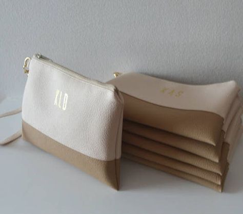 "These personalized wristlets are made of high quality faux leather in cream and beige. The interior is fully lined with cotton fabric The letters are printed in gold foil. An amazing gifts for your bridesmaids. Measurements: 9\" x 6\" - zipper closure - inside pocket - removable wrist-strap - simple and trendy design - hand crafted Visit my shop for more items: http://www.etsy.com/shop/navesdesign Thanks for looking!" Personalized Bridal Gifts, Bridal Clutch Purse, Unique Clutch, Personalized Clutch, Clutch Bag Wedding, Handmade Clutch, Wedding Clutch, Wedding Accessory, Bridal Clutch