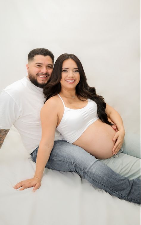 Simple white backdrop maternity photos Maternity White Backdrop, White Background Maternity Photos, Simple Maternity Pictures, Simple White Backdrop, Couple Maternity Photos, Indoor Maternity Photography, Couple Maternity, Pregnancy Photos Couples, Maternity Photography Studio