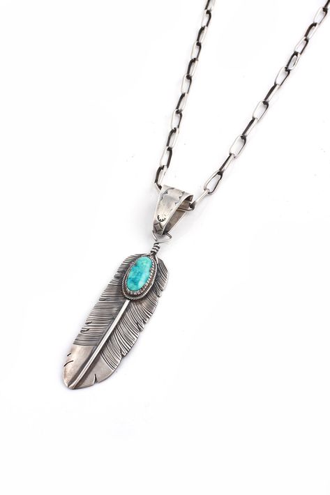 Navajo silversmith, L Jeer, set this genuine turquoise stone on his intricate handmade sterling silver feather. This large, graceful feather has exceptional detail and a hand stamped bail. The feather is the symbol for prayer for many Native Americans. Wear it long or short on chain or leather for many different looks. Hallmarked "L Jeer" and stamped Sterling. 4" long including bail, chain not included. Sparrow Jewelry, Silver Feather Necklace, Silver Smithing, American Lifestyle, Silver Linings, Chunky Earrings, Resin Ideas, Feather Jewelry, Jewelry Techniques