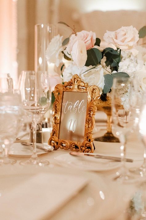 The antique gold mirror table numbers and candles on the reception tables gave me all the Bridgerton wedding vibes. I loved all the romantic touches at this fairytale spring wedding in Boston. If you're looking for New England's best wedding photographer to capture all of your wedding details, contact Lena Mirisola Photography! Wedding Table Numbers Mirror, Fairy Tale Wedding Table Numbers, Vintage Mirror Table Numbers, Vintage Gold Frame Table Numbers, Table Numbers Wedding Vintage, Victorian Themed Wedding Decoration, Gold Mirror Table Numbers, Vintage Card Box Wedding, Classy Table Numbers Wedding