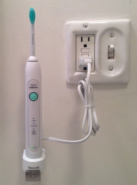 Get the electric toothbush off the vanity top - Teeny Tiny Little Shelf for Electric Toothbrush - IKEA Hackers Bathroom Toothbrush Storage, Electric Toothbrush Storage, Small Bathroom Shelves, Sonicare Toothbrush, Little Shelf, Hide Cords, Electric Toothbrush Holder, Led Shower Head, Ikea Bathroom