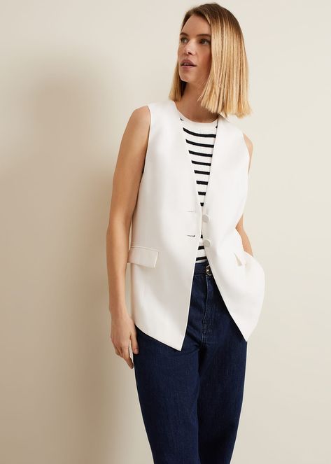 Embrace The Tailoring Trend With Our Inara Waistcoat. Our White Waistcoat Is Designed To An Oversized Fit And Features Covered Buttons And Pockets. Style With Matching Trousers Or Jeans.This Style Is Responsibly Sourced. This Style Has Been Made From Certified Renewable Wood Sources. Lenzing ™ Ecovero ™ Viscose Uses A Responsible Production Process, Generating Up To 50% Lower Emissions And Water Impact Than Generic Viscose. Lenzing ™  And Ecovero ™  Are Trademarks Of Lenzing Ag. Find Out More About The Fibres We Use Here.Regular Fit. White Vest Outfits For Women, White Vest Outfit, Waistcoat Outfit, White Waistcoat, Pleated Fashion, Waistcoat Woman, Striped Vests, Vest White, Fashion Dresses Casual