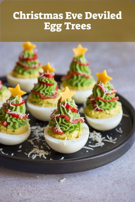 Deviled eggs decorated as tiny Christmas trees, an adorable appetizer for Christmas Eve meals. Christmas Platter Ideas Finger Foods, Easy Christmas Party Food, Christmas Party Buffet, Food Ideas For A Crowd, Christmas Eve Ideas, Christmas Eve Appetizers, Christmas Eve Food, Holiday Finger Foods, Christmas Eve Meal