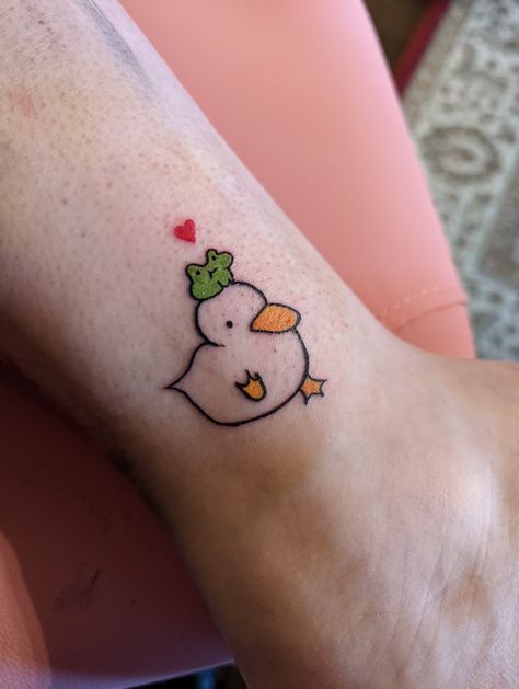 A small tattoo for my cousin. It's a little duck with a frog on his head ! Frog Wine Glass Tattoo, Duck Tattoos Small Funny, Weird But Cute Tattoos, Small Cute Frog Tattoo, Super Cute Tattoos, Lil Frog Tattoo, Frog Tattoos Cute, Frog And Duck Tattoo, Duck Tattoos Cute