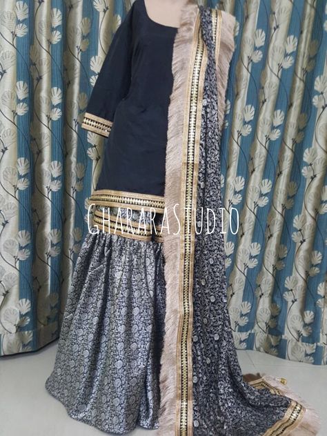 Black kamkhwab Gharara with beautiful golden and black zari laces.   ORDER ONLINE. Whatsapp at 9971865919 to discuss.  #gharara #ghararastudio #ghararastudiobyshazia #kamkhwabgharara #blackgharara #ghararah #ghararas #ghararalove #ghararasale #fashionblogger #instafashion #fashiongirl #fashiongram #fashiondiaries #bridalgharara #partygharara #ghararafashion #buyghararaonline #orderonlinegharara #fashionpost #muslimwear #muslimbride #muslimahfashion Kamkhwab Gharara Designs, Kimkhab Gharara Design, Kimkhab Gharara, Black Gharara, Mummy Dress, Pink Gharara, Gharara Designs, Eastern Dresses, Indian Outfits Lehenga