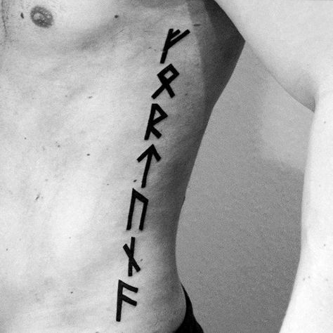 Guys Rib Cage Side Black Ink Rune Lettering Tattoos Viking Quote, Rune Tattoos, Rune Vichinghe, Runes Tattoo, Viking Tattoos For Men, Viking Rune Tattoo, Symbols Of Strength Tattoos, Rib Tattoos For Guys, Scandinavian Tattoo