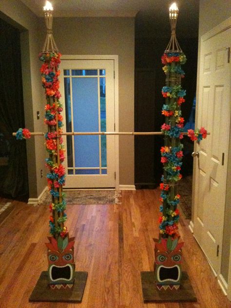 Limbo pole with Tiki Gods and flames at the top for 7yo nieces slumber party. Tropisk Fest, Hawaii Theme, Hawaiian Party Theme, Aloha Party, Hawaiian Party Decorations, Luau Theme Party, Hawaiian Luau Party, Luau Birthday Party, Hawaiian Birthday Party