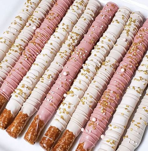 Strawberry Dipped Pretzels, Pretzel Rods Dipped Wedding, Chocolate Strawberries And Pretzels, Pretzel Sticks Dipped In Chocolate Pink, Pretzel Dip In Chocolate, Birthday Pretzel Treats, Pink White And Gold Party Decoration Dessert Tables, Pink White And Gold Chocolate Covered Pretzels, Pretzel Stick Dessert