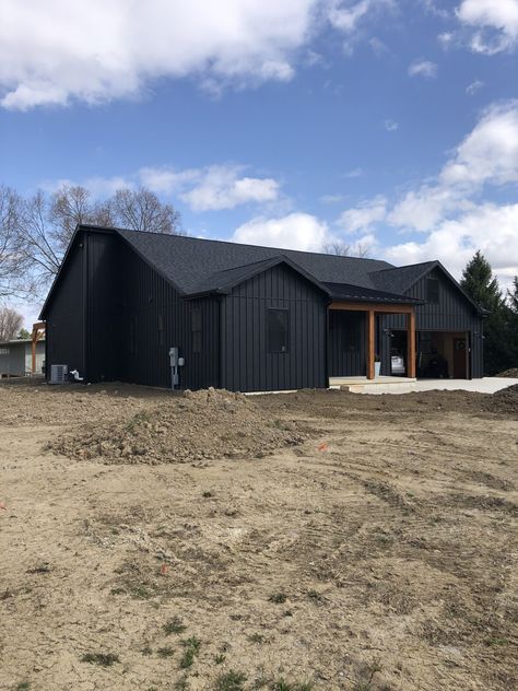 Photo Gallery of Our Finished Projects | Metal Exteriors Black Steel House Exterior, Metal Batten Siding, Black Steel Roof House, Black Board And Batten House, Black Metal Board And Batten Siding, Black House With Black Metal Roof, Brick And Metal House, Black House Metal Roof, Standing Seam Metal Siding