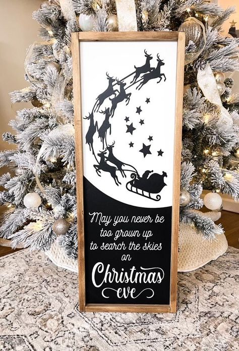 "Large Santa Christmas eve sign. Santa & sleigh christmas eve sign. Farmhouse Christmas eve search the skies sign. Search the skies on Christmas Eve sign. Farmhouse Christmas sign. Large black and white Christmas Eve. Size 32\" high x 12\" wide Please watch shipping time closer to HOLIDAYS RUSH MY ORDER UP -1-3 business days to have ready to ship USPS - $10-click here : https://www.etsy.com/listing/787030762/rush-order-to-ship-usps-in-1-3-rush-my?ref=shop_home_active_39&frs=1 RUSH MY ORD Black Christmas Signs, Christmas Sign Cricut, Christmas Sign Diy, Wood Christmas Signs, Farmhouse Christmas Signs, Santa And Sleigh, Cricut Signs, Christmas Booth, Christmas Cricut