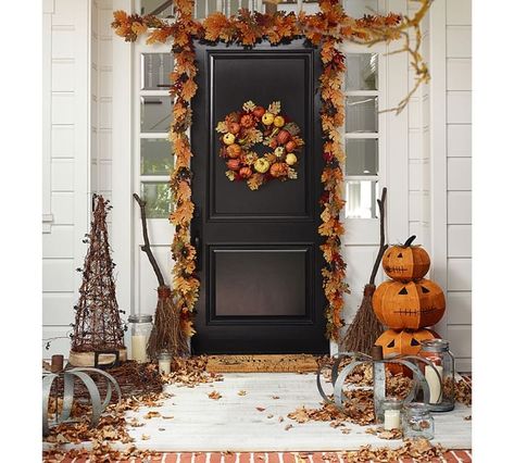 A fall porch with Halloween accents, and red, brown leaves. Fall Garland Front Door, Garland Front Door, Maple Leaf Wreath, Hallowen Ideas, Autumn Wreaths For Front Door, Fall Planters, Harvest Wreath, Door Wreaths Fall, Fall Garland