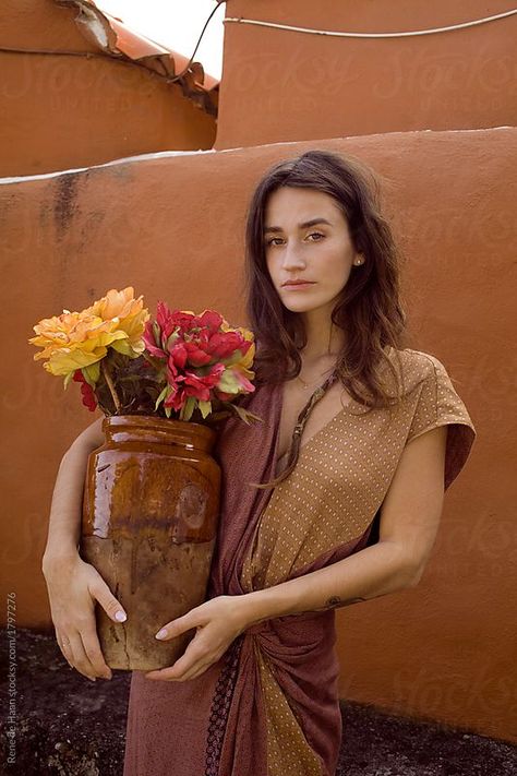 young woman with vase and flowers by Rene de Haan for Stocksy United Woman Holding Flowers Photography, Women With Flowers Photography, Vase Photoshoot, Holding Flowers Pose Reference, Pose With Flowers, Poses With Flowers, Woman Holding Flowers, Woman Vase, Portrait With Flowers