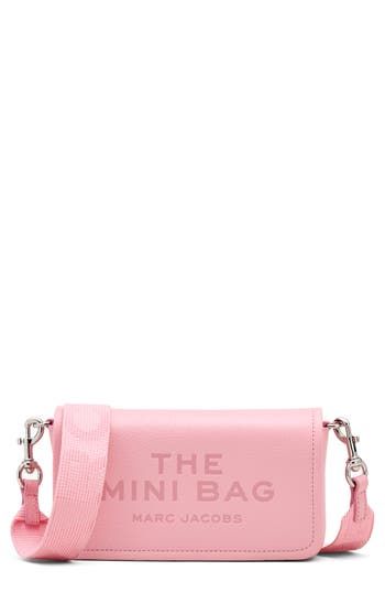 Signature logo detailing and richly textured leather distinguish a scaled-down crossbody fitted with multiple pockets perfect for organizing your essentials. Magnetic-snap flap closure Removable, adjustable crossbody strap Interior wall pocket; eight card slots Structured silhouette with flat base for stability Lined Leather Imported Sac Marc Jacobs, Birthday Fit, Pink Bags, Leather Mini Bag, Dream Bag, Pink Stuff, Debossed Logo, Travel Wishlist, Ladies Clutch