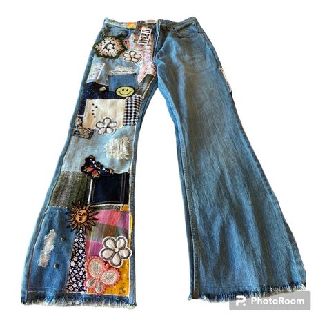 Blue Women Jeans From Urban Outfitters With Designs And Different Colors A Little Bit, A Green, Purple Orange, And They Have Patches On Jeans Iron On Patch Jeans, Jean Patches Ideas, Bride Jeans, Painting Jeans Ideas, Patch On Jeans, Diy Patchwork Jeans, Thrift Upcycle Clothes, Art On Pants, Patch Work Jeans