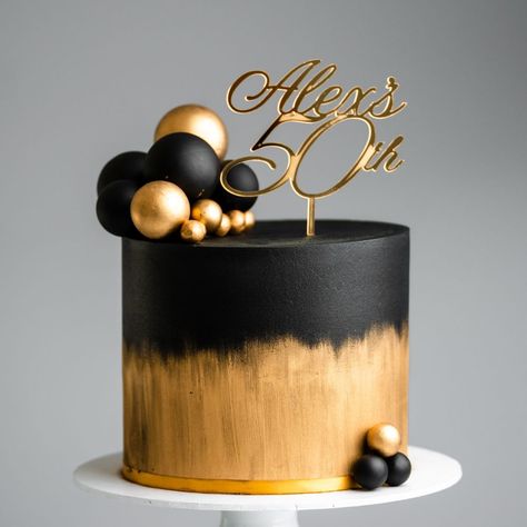 Brushed Gold and Black Sphere Cake Tutorial | buttercream, cake, ganache, icing, chocolate | Our cake decorating courses: https://vimeo.com/rosiesdessertspot/vod_pages And another black and gold cake coming your way! This one features a brushed... | By Rosie's Dessert Spot Golden Cake Design For Men, Black And Gold 80th Birthday Cake, Black Ganache Cake, Simple Black And Gold Cake, Black And Gold Birthday Cake For Him, Black And Gold Cake Birthday For Women, White Black And Gold Cake, Torte Schwarz Gold, Cake Designs Black And Gold