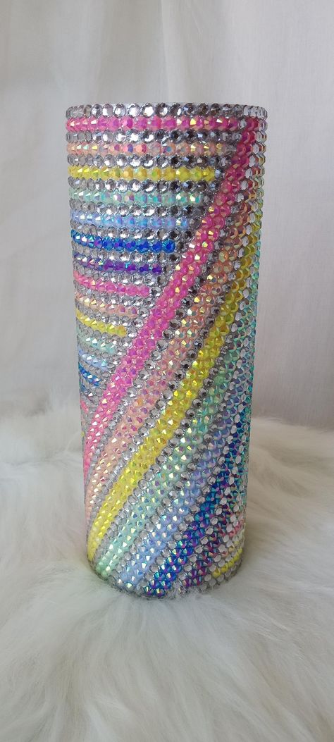 20oz stainless steel cup with lid and straw (not photographed).  Great for iced & hot beverages.  This full cup has been hand rhinestoned with crystal clear/silver & rainbow pastel rhinestones. The white & pastel rhinestones used have an aurora borealis (ab) finish that adds a ton of extra sparkle and color to the design. Cup diameter is approx. 3inches. Hand wash only.  Not dishwasher safe.  Not microwave/stove/oven safe. Rhinestone Tumbler Ideas, Blinged Cups, Things To Bedazzle, Bedazzled Cups, Bedazzled Items, Market Patterns, Bling Stuff, Rhinestone Ideas, Glitter Things