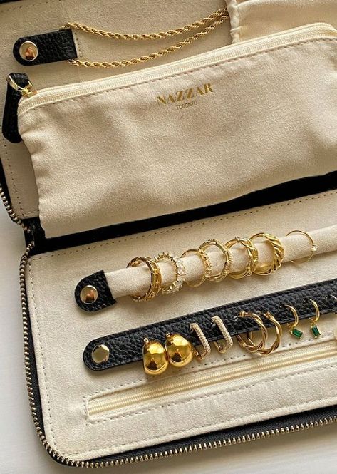 The perfect travel pouch. Keep all your jewelry safe in our Nazzar Jewellery Travel pouch. Slip it in your luggage between your clothes, or just keep it in your hand bag! Fits perfectly! Length: 23cmwidth: 12cmThickness: 2. 5cmMade with: Anti-tarnish lining treated microsuede Vegan leather What fits in the bag? Necklace, rings, eat studs, bracelets, and your hoops Anti-tarnish l...#JewelryLovers #Tidiness #the #Gemstone #Jewelry #Organizers #World #Exploring #The #of #Art #of #JewelryDesign Black Leather Jewelry, Jewellery Organizer, Bag Necklace, Glamorous Jewelry, Dad Jewelry, Travel Jewelry Organizer, Leather Jewellery, Jewelry Organizers, Gelang Manik