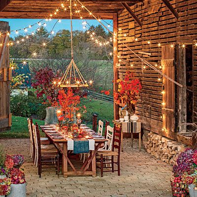 As the air turns crisp, take it outside for a setting that is sure to wow. A rustic barn makes the perfect dining room for a fall meal. Living Pool, Party Barn, Catering Food, Outside Living, Fall Outdoor, Outdoor Dining Area, Rustic Barn, Outdoor Oasis, Southern Living