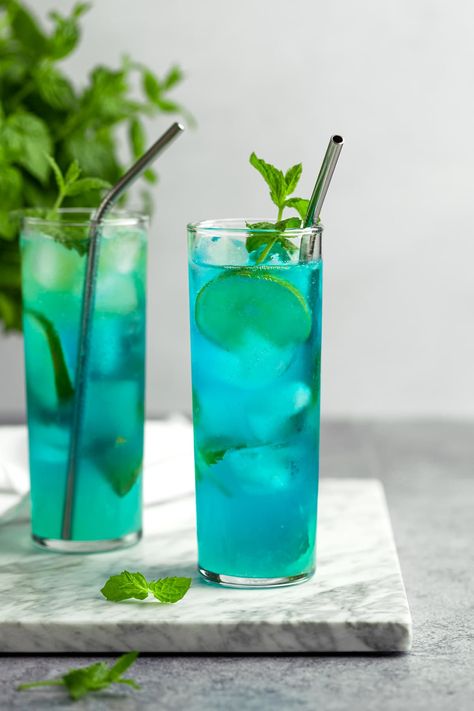 Blue Mojitos - The Littlest Crumb Blue Mojito Recipe, Green Cocktails, Thyme Simple Syrup, Blueberry Simple Syrup, Basil Simple Syrup, Classic Mojito, Best Summer Cocktails, Strawberry Mojito, Blue Drinks