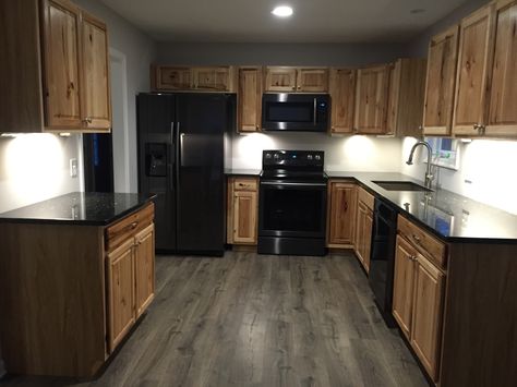 Hickory cabinets black stainless appliances Black Kitchen Appliances Wood Cabinets, Wood Cabinets Black Appliances, Cabinets With Black Appliances, Kitchen Cabinets With Black Appliances, Hickory Kitchen Cabinets, Black Stainless Appliances, Hickory Kitchen, Black Appliances Kitchen, Stained Kitchen Cabinets