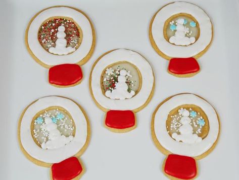 Get Snow Globe Cookies Recipe from Food Network Snow Globe Cookies, Snow Globe Cookie, Globe Cookies, Pillsbury Sugar Cookies, Simple Sugar Syrup, Small Snowman, Gingerbread Lady, Frozen Cookies, White Icing