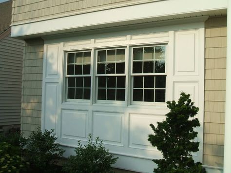 Garage Door To Window Conversion, Renovate Garage, Moulding Around Windows, Carport Renovation, Window Bump Out, Raised Panel Wainscoting, Panel Wainscoting, Awning Over Door, Garage Transformation