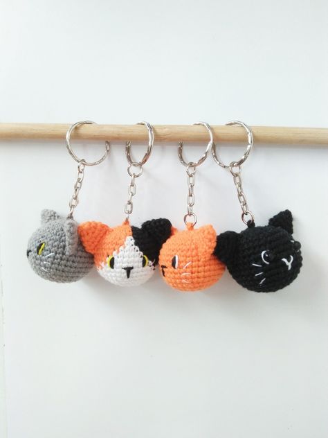 Four crochet cat head amigurumi as a keychain Cat Amigurumi Keychain, Crochet Market Stall, Ginger And Black Cat, Cat Head Crochet, Keychain Ideas Crochet, Cat Crochet Keychain, Cat Keychain Crochet, Easy Crochet Keychain, Crochet Cat Keychain