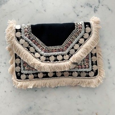 New cutch!   http://liketk.it/2CAyU #liketkit @liketoknow.it #LTKunder100 #LTKstyletip #LTKspring #LTKunder50 #LTKitbag Boho Bags Diy, Easy Crochet Top, Handbags Trendy, Boho Chic Bags, Diy Earrings Easy, Fringe Clutch, Stylish School Bags, Boho Clutch, شال كروشيه