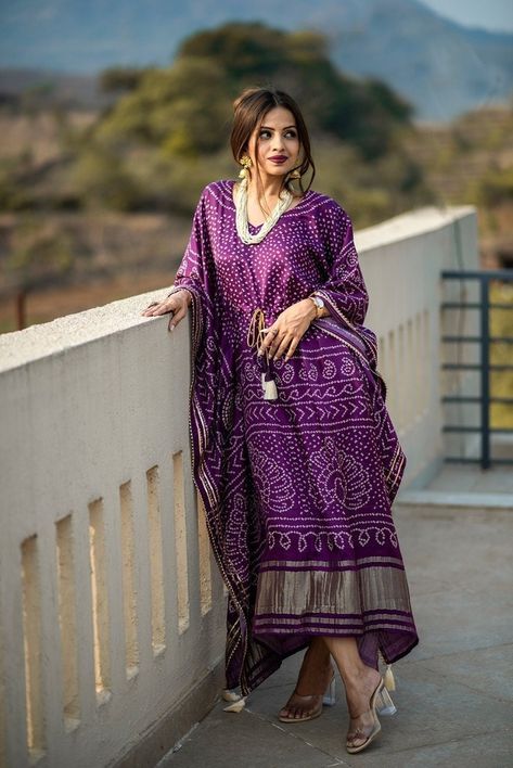 "Kaftan collection This Oversize Kaftan dress is the best choice for the summer, can be transformed for any occasion from casual to Special Occasion. Kaftan(Stitched) 👉🏿Kaftan Fabric : Pure Gaji Silk  👉🏿Kaftan work : Bandhej Digital Print with Gotta Patti Lace Border also comes with tassels  👉🏿Chest : Free Size \" (Customer can adjust up to 44\" for your body comfort ) 👉🏿Length : 50\" Package Contain : Kaftan 👉🏿Weight : 0.310 k" Women Kaftan Styles, Kaftan Style Dresses, Kaftan Kurta, Kaftan For Women, Bandhani Dress, Trendy Dresses Summer, Kaftan Designs, Lehenga Blouse Designs, Gotta Patti