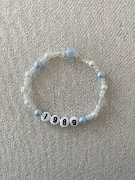 Taylor Swift Bead Bracelet Words Ideas Taylor Swift, Taylor Swift Friendship Bracelet Blue, 1989 Clay Bead Bracelet, Easy Taylor Swift Bracelet Ideas, Making Taylor Swift Bracelets, Taylor Swift Era Bracelet Ideas, Bracelet Ideas Clay Beads Taylor Swift, 13 Taylor Swift Bracelet, Simple Taylor Swift Bracelets