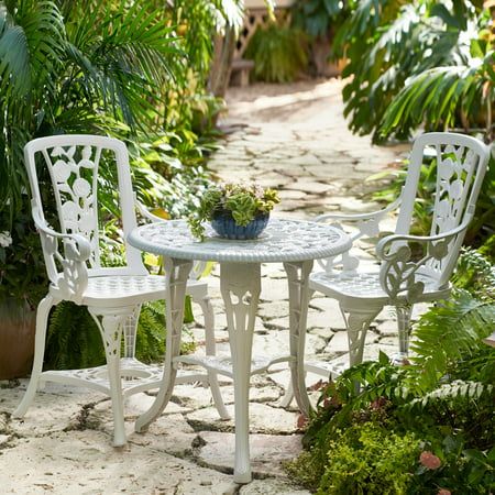 Brylanehome 3 Piece Rose Bistro Set, White Patio Furniture.Our gorgeous outdoor bistro set will surely bring compliments your way when guests see this detailed furniture. ; 200 lb. capacity on each chair ; 50 lb. capacity on table ; Center fits most standard umbrellas ; Cast of white weather-resistant poly resin with a charming rose motif ; Assembly required Includes: two 34.5"H x 16.5"W x 17.75"L chairs and a 26.5"Diam. table with umbrella hole (umbrella not included). ABOUT THE BRAND: Making H White Patio Furniture, Table With Umbrella, Camp Chair, White Patio, 3 Piece Bistro Set, Bistro Furniture, Outdoor Bistro, Outdoor Bistro Set, Best Outdoor Furniture