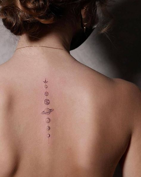 Single needle solar system tattoo on the upper back Subtle Space Tattoo, Universe Tattoo Back, Universe Inspired Tattoos, Solar Tattoo Designs, Small Solar System Tattoo, Spine Tattoos Space, Simple Solar System Tattoo, Planets Spine Tattoo, Space Back Tattoo