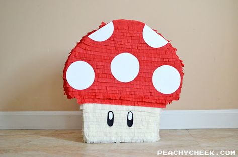 DIY Mario Mushroom Pinata Mushroom Pinata, Diy Family Game Night, Family Game Night Party, Scrabble Tiles Coasters, Homemade Pinata, Game Night Party, Diy Playing Cards, Game Night Parties, Playing Card Holder