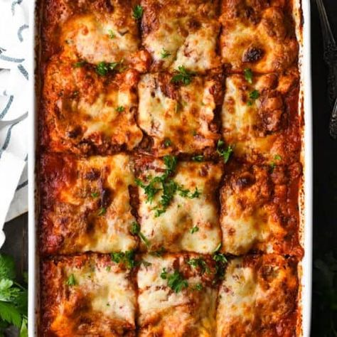 The best homemade lasagna recipe includes thick layers of sausage, ground beef, ricotta, Parmesan, and mozzarella cheeses in a made-from-scratch sauce. Pair the hearty, satisfying casserole with a Caesar salad and garlic bread for the ultimate family meal. Dinner Recipes | Dinner Ideas Easy Homemade Lasagna, Homemade Lasagna Recipes, Best Lasagna Recipe, Sausage Lasagna, Easy Lasagna Recipe, Traditional Lasagna, Cheese Lasagna, Vegetable Lasagna, Homemade Lasagna