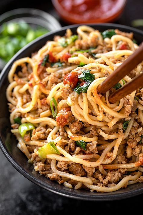 Spicy pork with noodles is a quick and delicious Asian-inspired meal brimming with the flavors of lemongrass, ginger and chili garlic sauce! | thecozyapron.com #spicyporkwithnoodles #spicypork #spicyporknoodles June Recipes, Pork Food, Asian Noodle Dishes, Asian Meals, Pork Noodles, Asian Noodle Recipes, Savory Treats, Asian Dinners, Mince Recipes