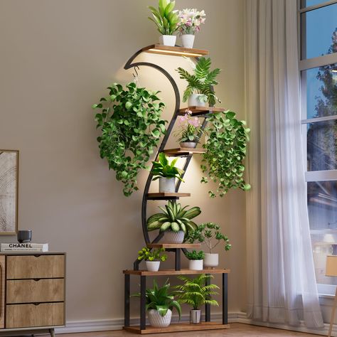 PRICES MAY VARY. [Upgraded Tall Swan-Shaped Plant Stand]WIWIDRM enhanced indoor plant stand, artfully crafted in a graceful swan-shaped design. Standing impressively at 68 inches tall, it features 7 tiers thoughtfully designed to showcase your botanical treasures. Each tier includes a pot holder, complemented by two bonus hooks for hanging plants, ensuring ample space for a variety of displays. [Indoor Plant Stand with Grow Lights]Equipped with integrated full-spectrum grow lights, this indoor p Indoor Plant Design, Decorating With Plants Indoors, Plant Stand Ideas Indoor, Plant Stand With Grow Light, Metal Plant Shelf, Large Plant Stand, Plant Shelf Ideas, Corner Plant Shelf, Plant Stands Indoor