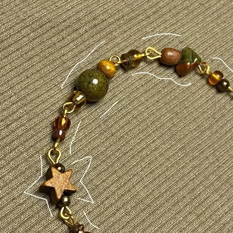 Starchaser Beaded Bracelet !! -Handmade -Sturdy(though, please handle with care) -Pretty Colour Palette -Adjustable  -Earth-toned theme Please remember these are all originally made and size/bead pattern maybslightly vary Look Bracelet Ideas, Wooden Bead Bracelet Ideas, Autumn Beaded Bracelet, Mismatched Bracelets, Cluttered Bracelets, Bracelet Bead Patterns, Bead Patterns Bracelet, Bracelet Patterns Beads, Wire Bead Bracelet