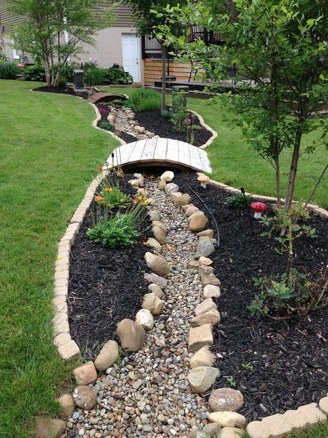 Dry River Bed Landscaping Ideas To Try In 2022 - A Nest With A Yard River Bed Landscaping Ideas, Dry River Bed Landscaping, River Bed Landscaping, Garden With Rocks, Bed Landscaping Ideas, Dry Riverbed Landscaping, Dry River Bed, Taman Diy, Yard Drainage