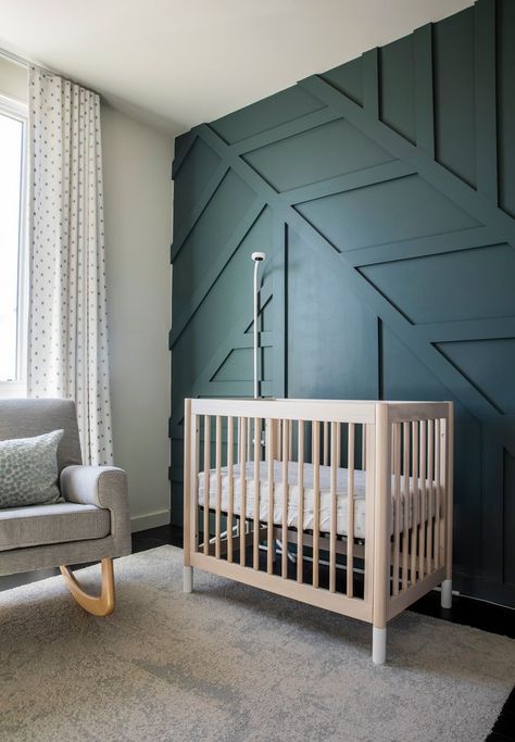 The decor of this baby nursery is future proof. While a charming room for a little one, the colour palette and the deep green panelled feature wall mean that a simple swap out of the furniture means an older child will feel just at home. Boys Bedroom Wall Color, Panelled Feature Wall, Custom Millwork, Baby Boy Room Decor, New Rochelle, Bedroom Wall Colors, London Apartment, Luxury Interiors, Architectural Details