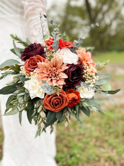 These STUNNING arrangements are made from high quality silk and foam flowers. Get the look of real flowers without the astronomical price!  Bridal measures approximately 16"  There are wrapped very thoroughly with floral tape and ribbon Production time is 3-5 business days. One week for shipping. I do offer rush options Burgundy And Orange Wedding Flowers, Rust Wedding Flowers, Terracotta And Burgundy, Fall Flower Wedding Bouquets, Burnt Orange Wedding, Fall Wedding Bouquet, Grass Bouquet, Orange Bouquets, Orange Wedding Flowers